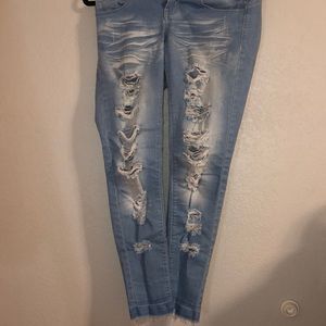 ripped blue jeans, light wash